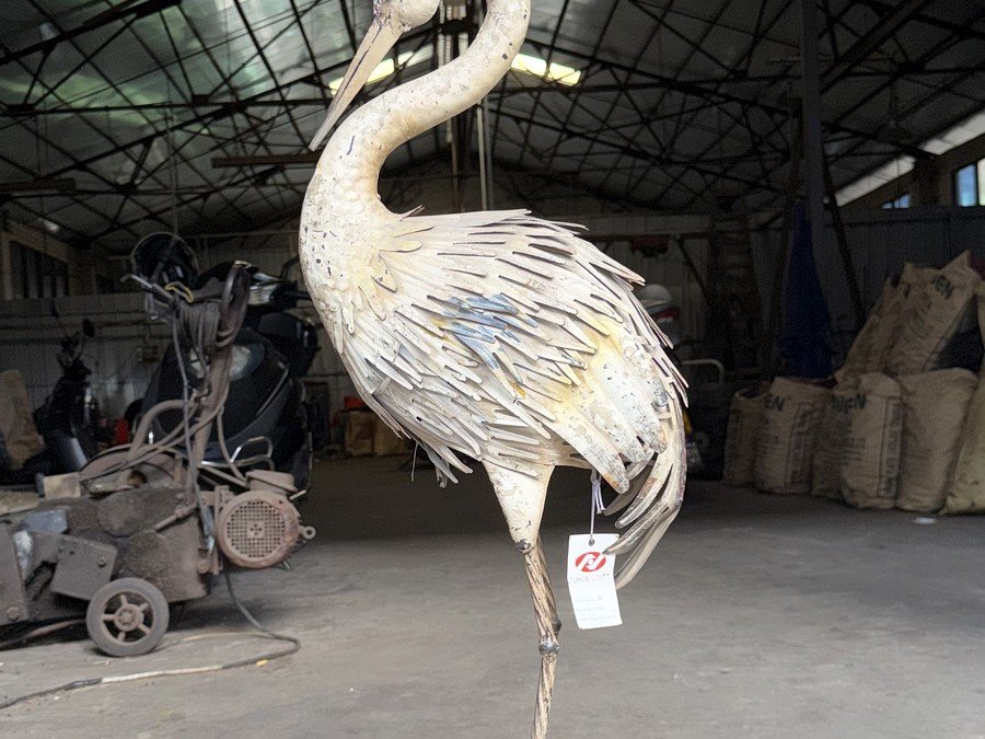 Life-size metal crane sculpture in our workshop